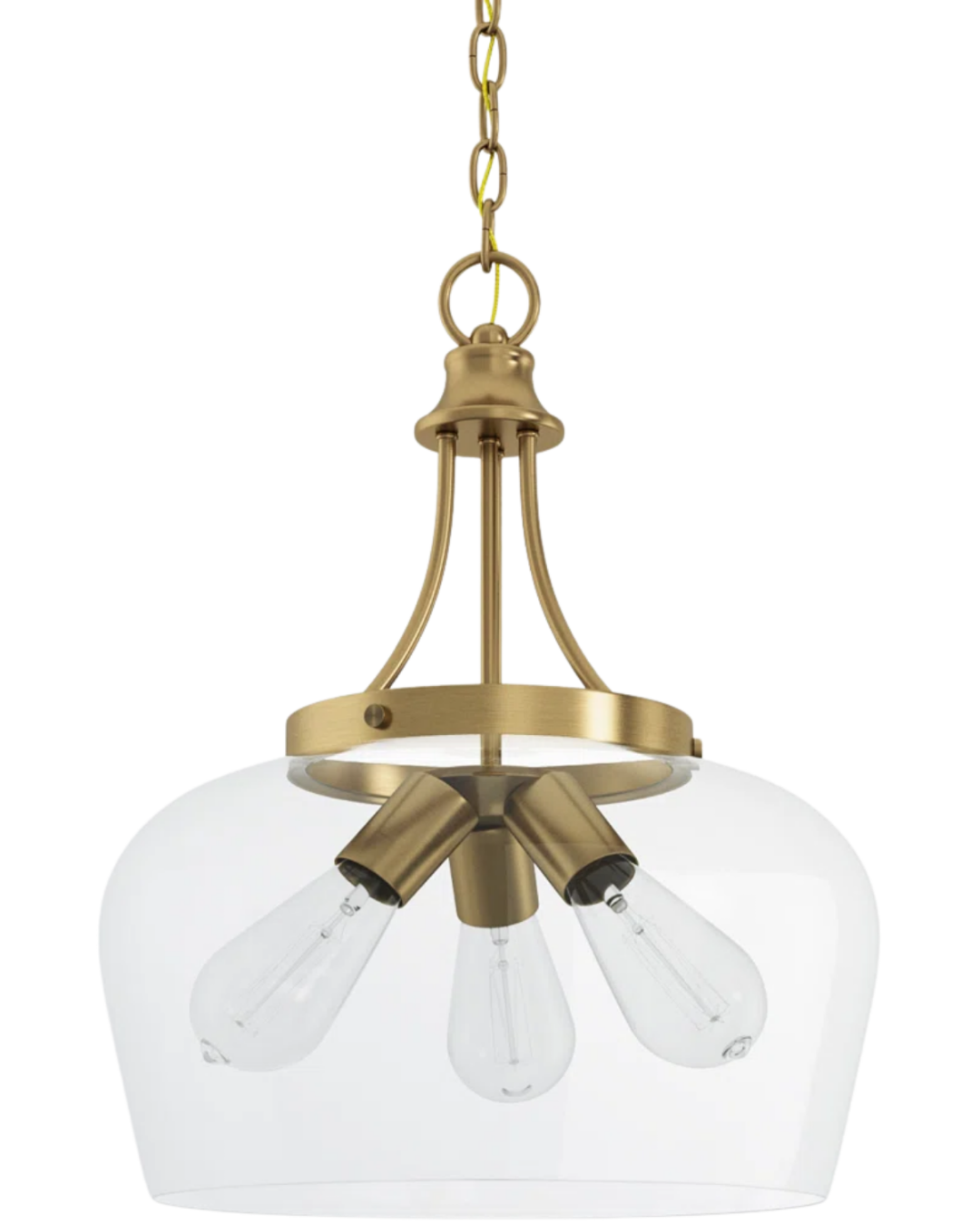 Breena Dome Pendant by Birch Lane with a clear glass shade and warm brass finish hanging above a navy blue kitchen island.