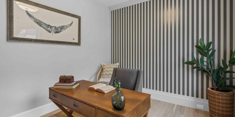 Home office with vertical stripe accent wall