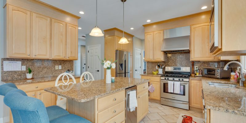 kitchen before- refrigerator in hallway