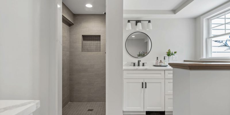 Laundry room bathroom combo with tiled shower, neutral bathroom tile, boho bathroom ideas