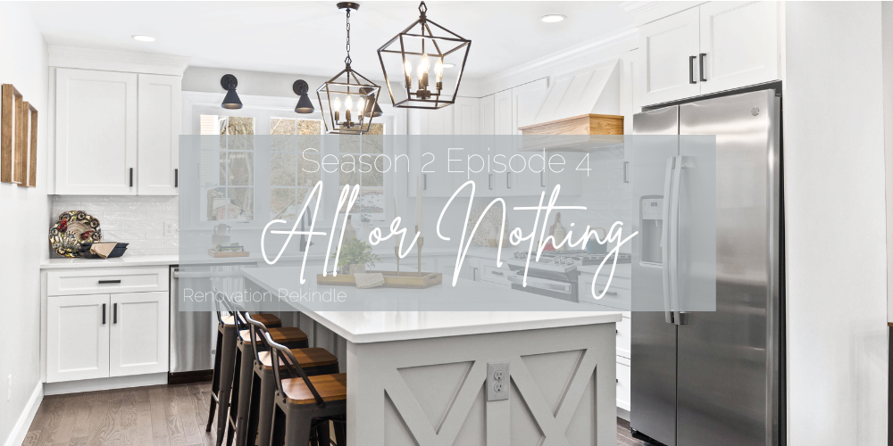 Bright white kitchen with a large kitchen island painted in a warm gray, Sherwin Williams Crushed Iced.