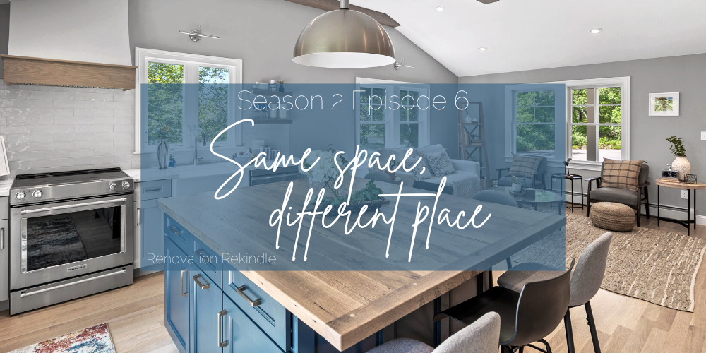 Open concept single family home remodel, with a large square center island made of reclaimed wood, with dark blue colored cabinetry.