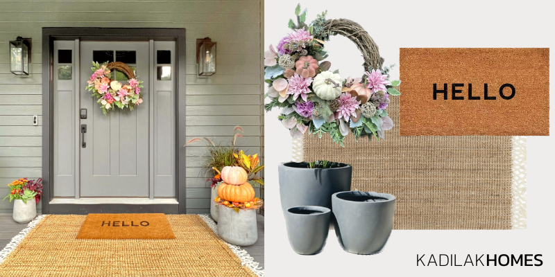 Fall front porch idea for your front door with layered rugs, a pastel wreath, and modern cement planters.