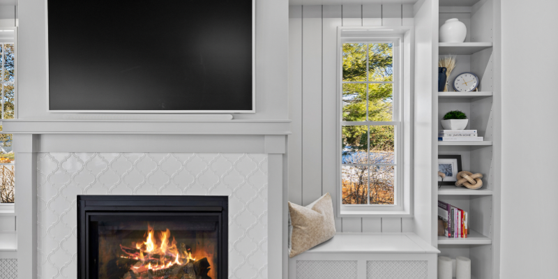 fireplace surround with window seat, book cases, benjamin moore Smoke Embers AC-28, flip top seats, fireplace with window on either side