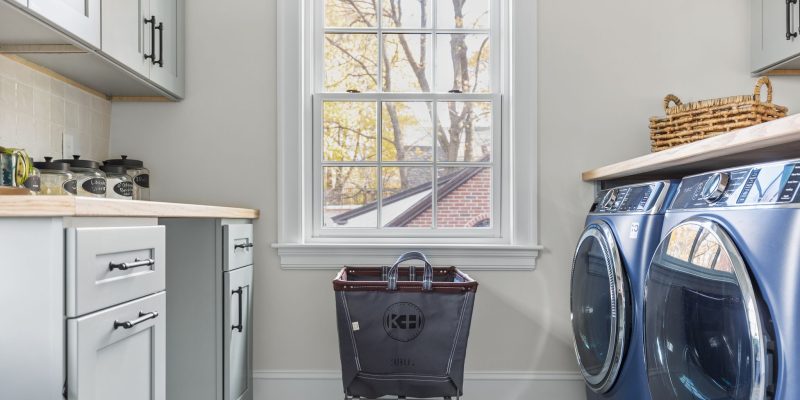 Laundry room with steel canvas kadilak homes laundry basket nook