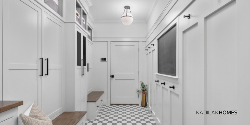 Mudroom with mini star and cross flooring, fireclay tiles shale and halite, benjamin moore horizon paint, extra storage, mudroom ideas, built in chalkboard, mudroom with doors, mudroom with drawers