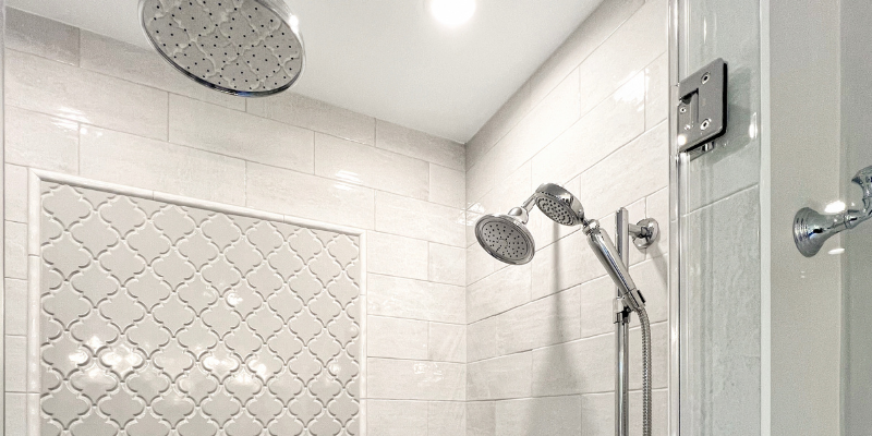 Anatolia Soho beveled arabesque tile in Gallery Grey, Kohler Functional 10" rain head, kohler devonshire shower trim, kohler chrome shower, monopole 5x14 moon tile, primary shower ideas