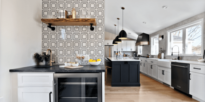 Kitchen design with a mini wet bar in the corner, consisting of a beer and wine fridge, a sink, and cabinet and shelf storage.