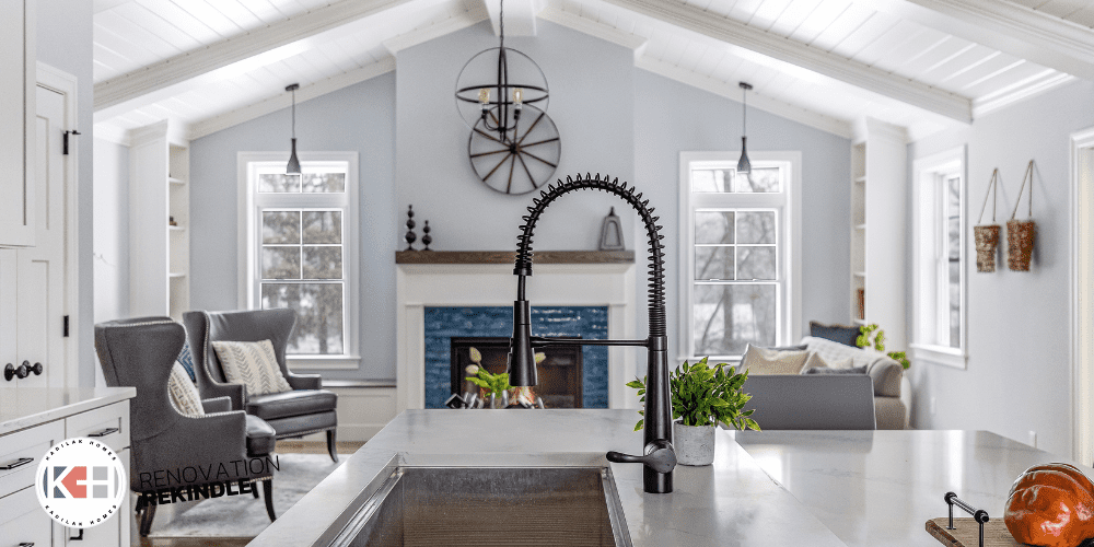 Kitchen next to family room, kohler simplice black faucet, kraus workstation, blue fireplace tile, shiplap ceiling, fireplace with windows on each side, fireplace built in ideas, window seat, window seat next to fireplace