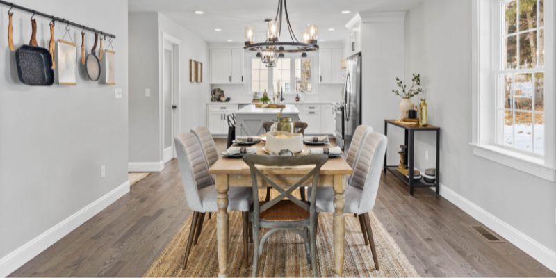 Small space kitchen and dining room wall with storage organization for pans and artwork