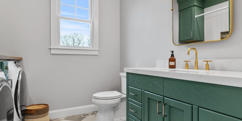 1990's maple bathroom cabinet and laundry room makeover, green bathroom cabinets, gray checkered tile floors, purist kohler faucet, laundry room with storage and hanging, laundry ideas, wood counter in laundry room, benjamin moore gothic Green, benjamin moore balboa mist
