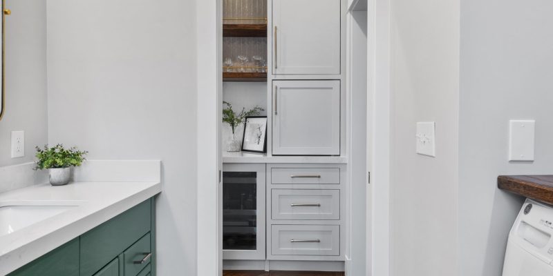 1990's maple bathroom cabinet and laundry room makeover, green bathroom cabinets, gray checkered tile floors, purist kohler faucet, laundry room with storage and hanging, laundry ideas, wood counter in laundry room, benjamin moore gothic Green, benjamin moore balboa mist